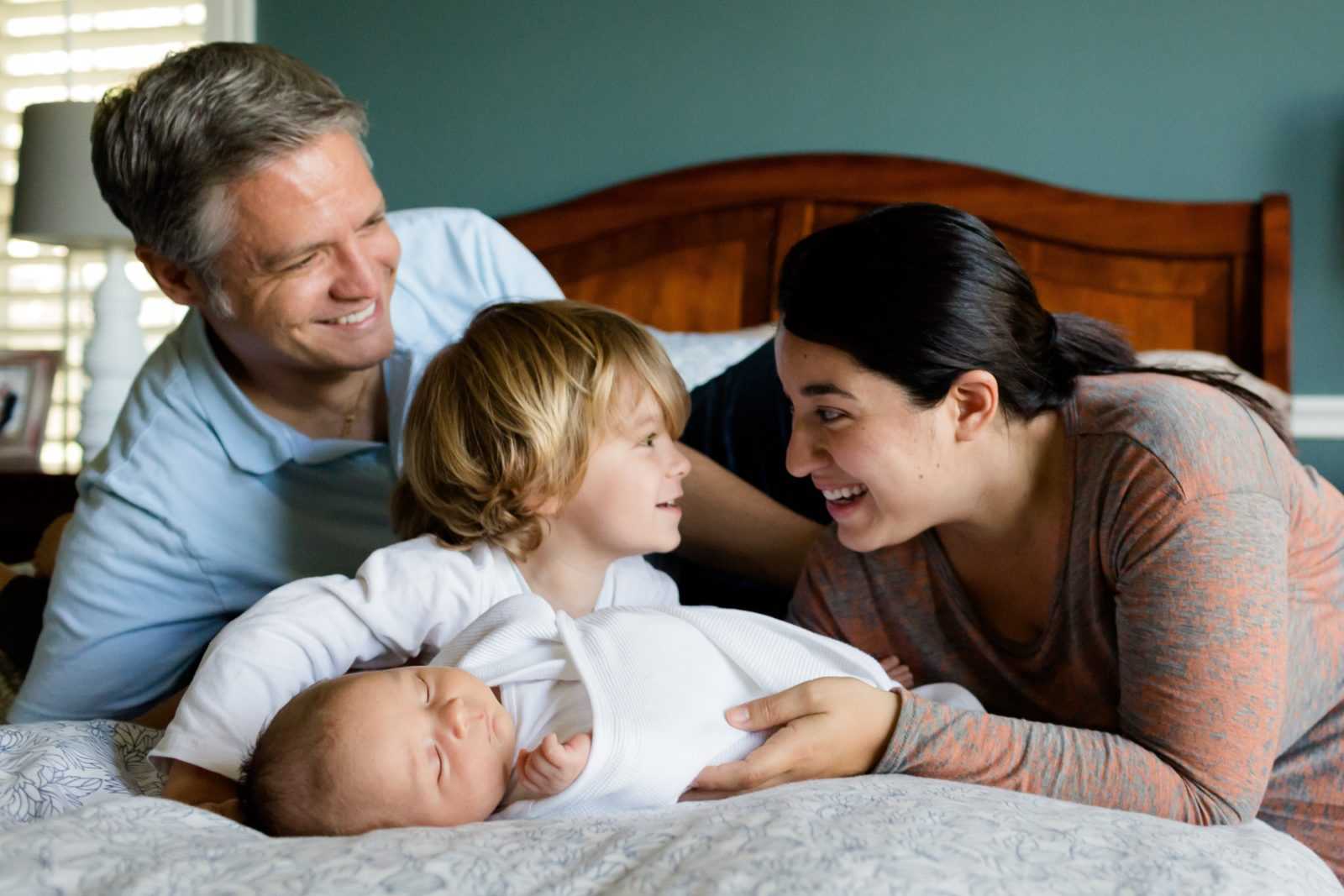 family with kids in bed